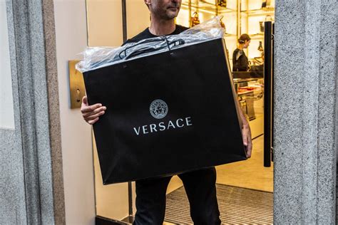 michael kors buys versace for 2 billion|does michael kors own versace.